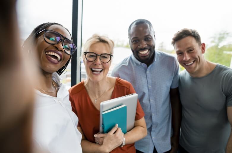 A group of people smiling for a photo