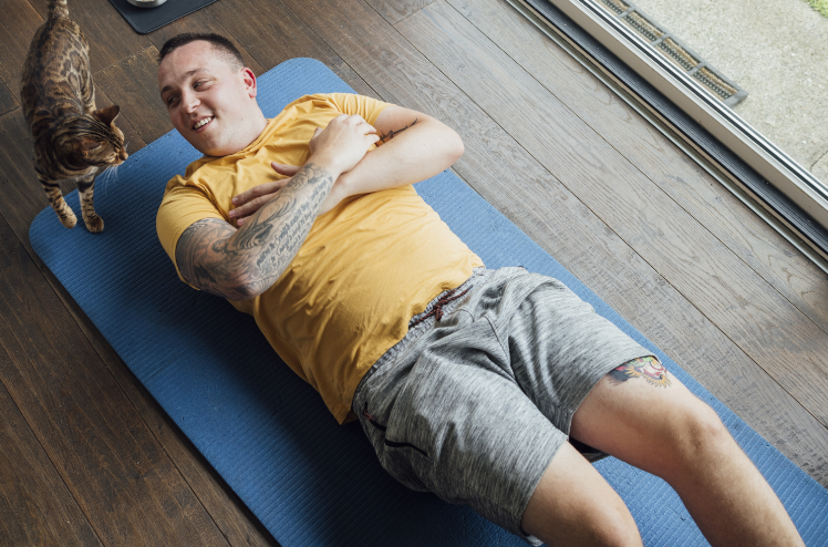 Man doing sit ups at home