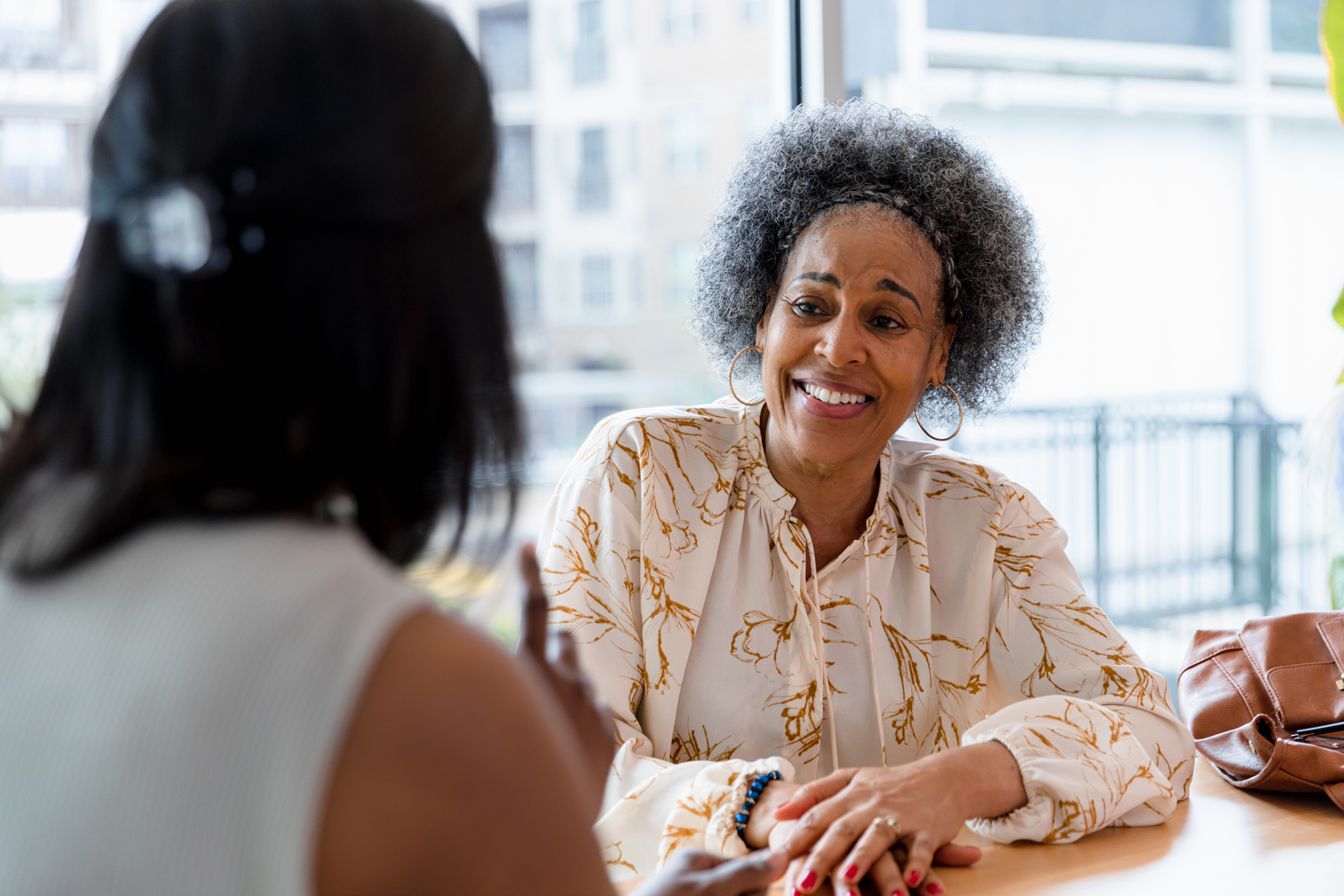 Two ladies in a performance coaching meeting
