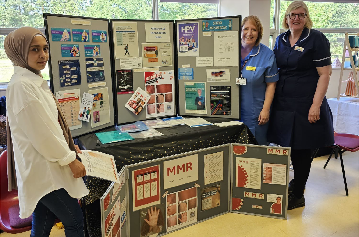 Vaccination team with display boards